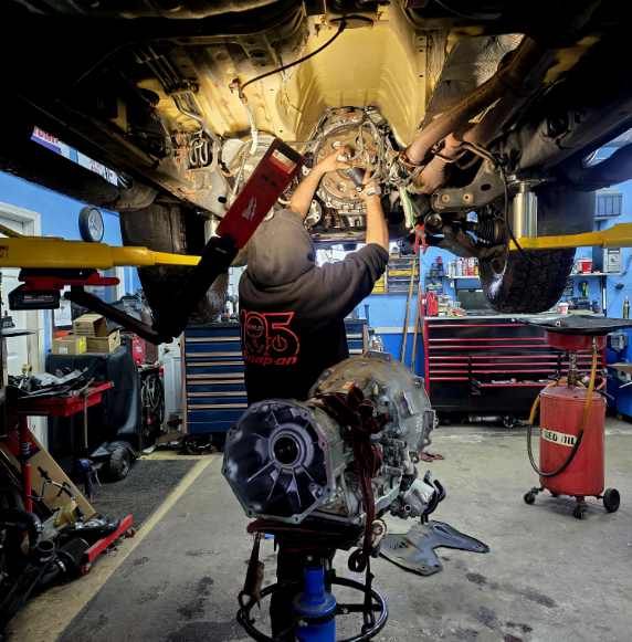 mechanic working under car